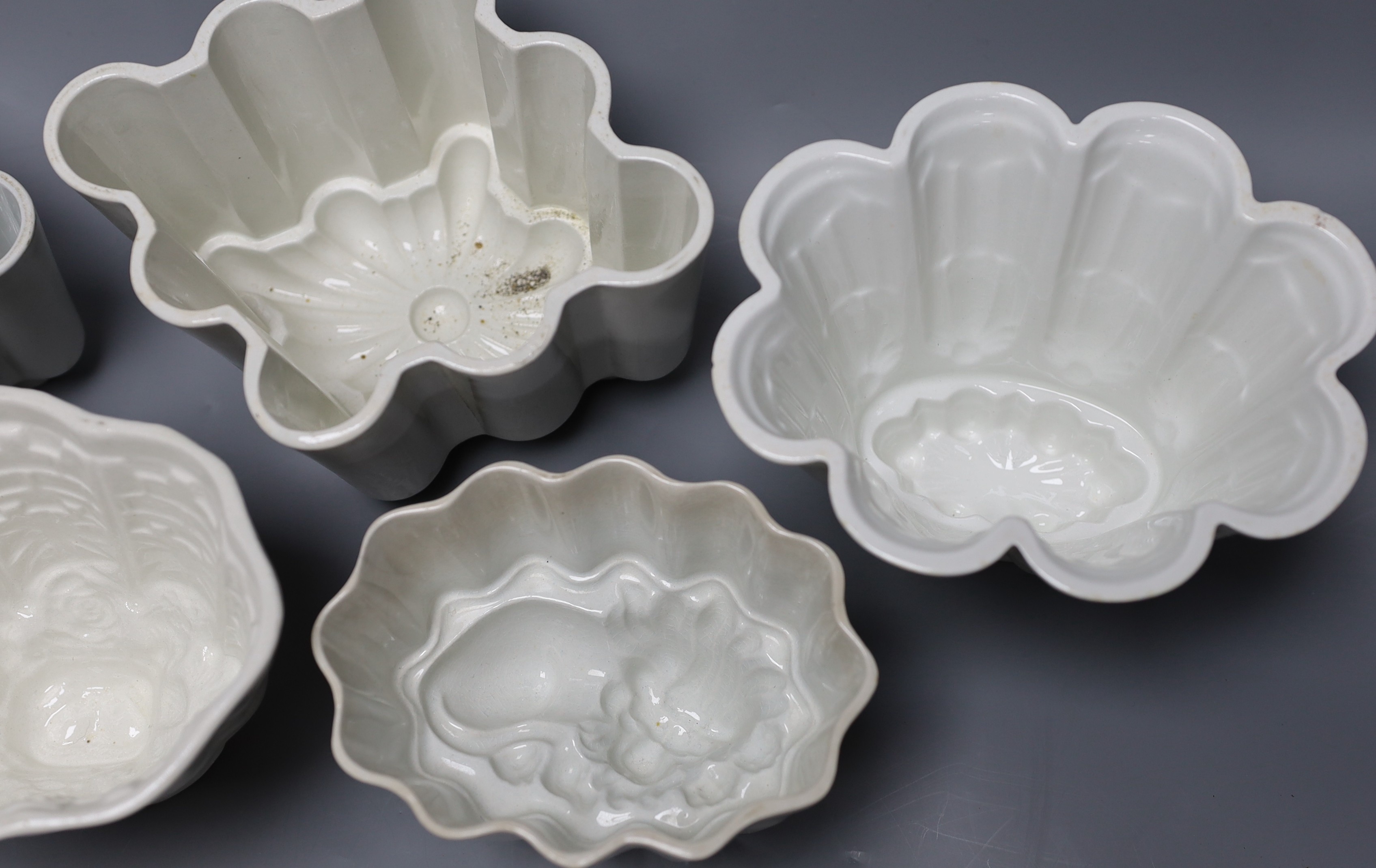 Five Victorian and later pottery jelly moulds, largest 12cm tall